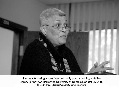 Pam reacts during a standing-room only poetry reading at the University of Nebraska on Oct 26, 2006.